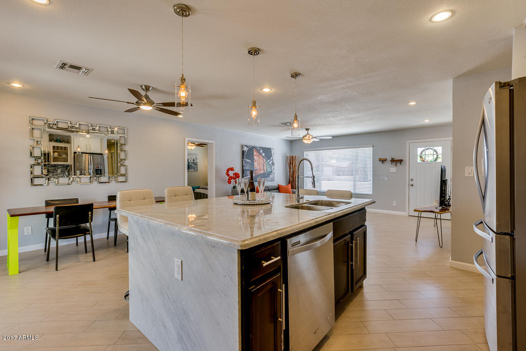 8525 East Chaparral Road Scottsdale, AZ 85250 - Photo 10 of 35 Contrasting Espresso Island Cabinets