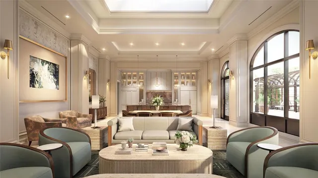 a living room with furniture fireplace and large windows