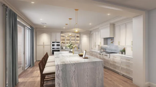 a kitchen with stainless steel appliances kitchen island granite countertop a sink refrigerator and cabinets