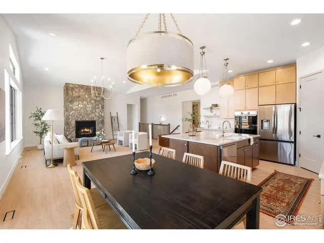 a view of living room with kitchen island furniture and large windows