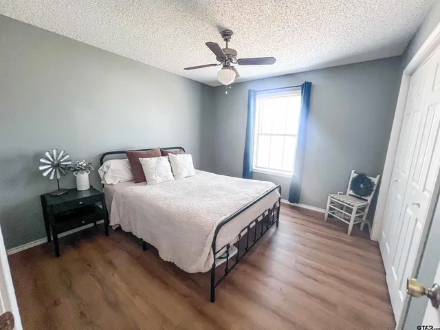 a bedroom with a bed and window