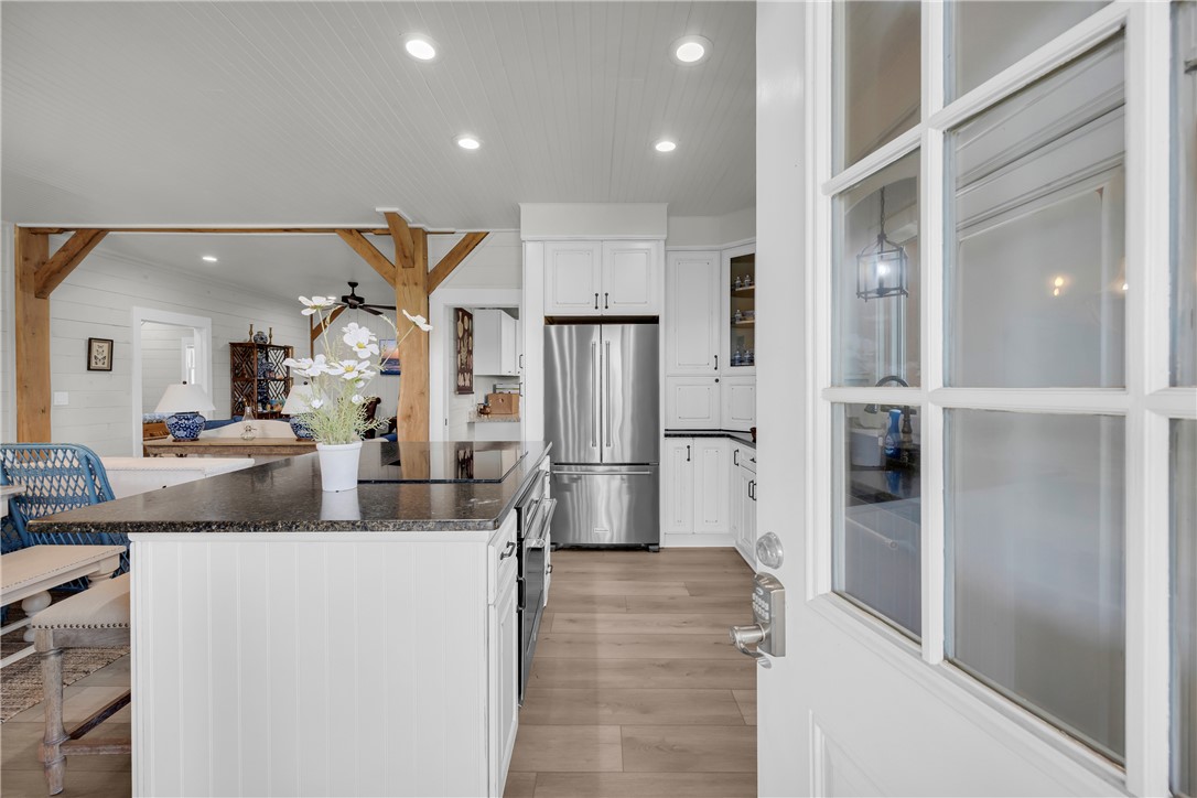 498 Raines Road Mountain Rest, SC 29664 - Photo 35 of 48 An inviting entrance reveals a bright open-plan kitchen with timeless wood-plank flooring.