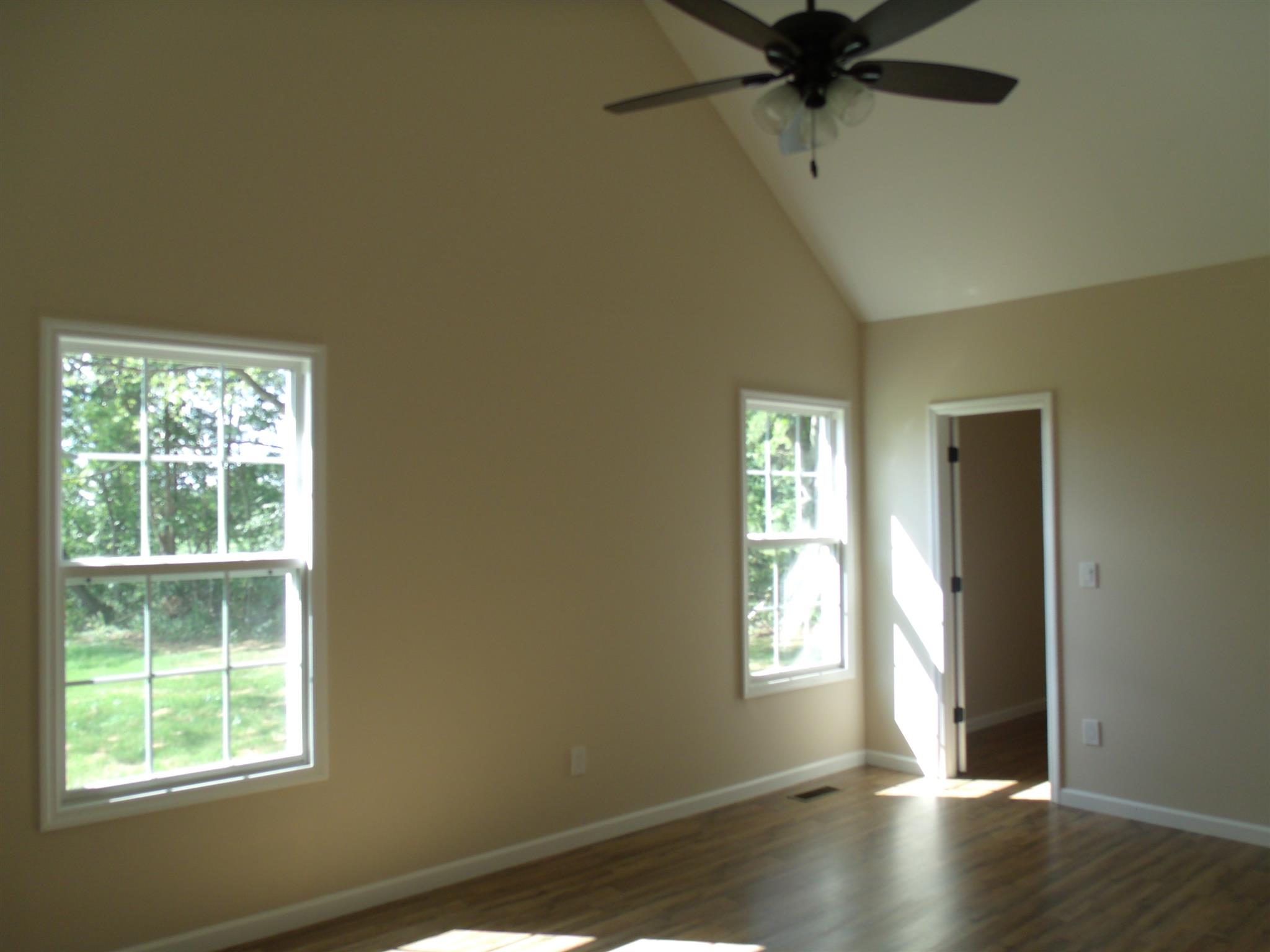 26 Liberty Road Winchester, TN 37398 - Photo 8 of 16 Master bedroom has his/her closets, ceiling fan, vaulted ceiling, and it's own full bath.