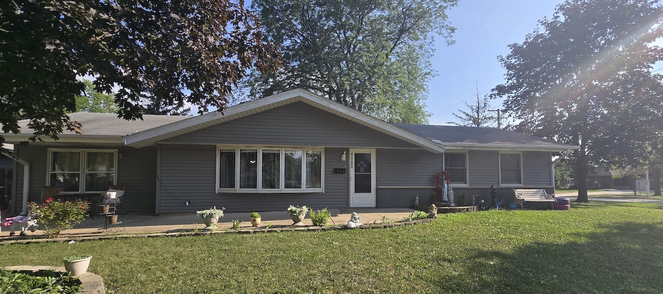 a front view of house with yard slide and outdoor seating