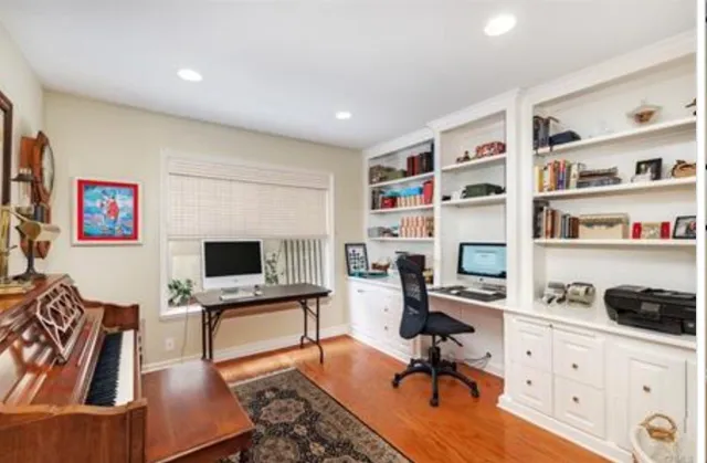 a workspace with furniture and a flat screen tv
