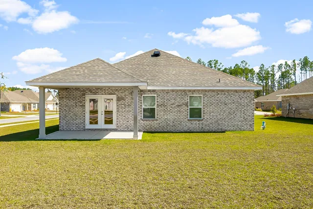 a front view of a house with yard