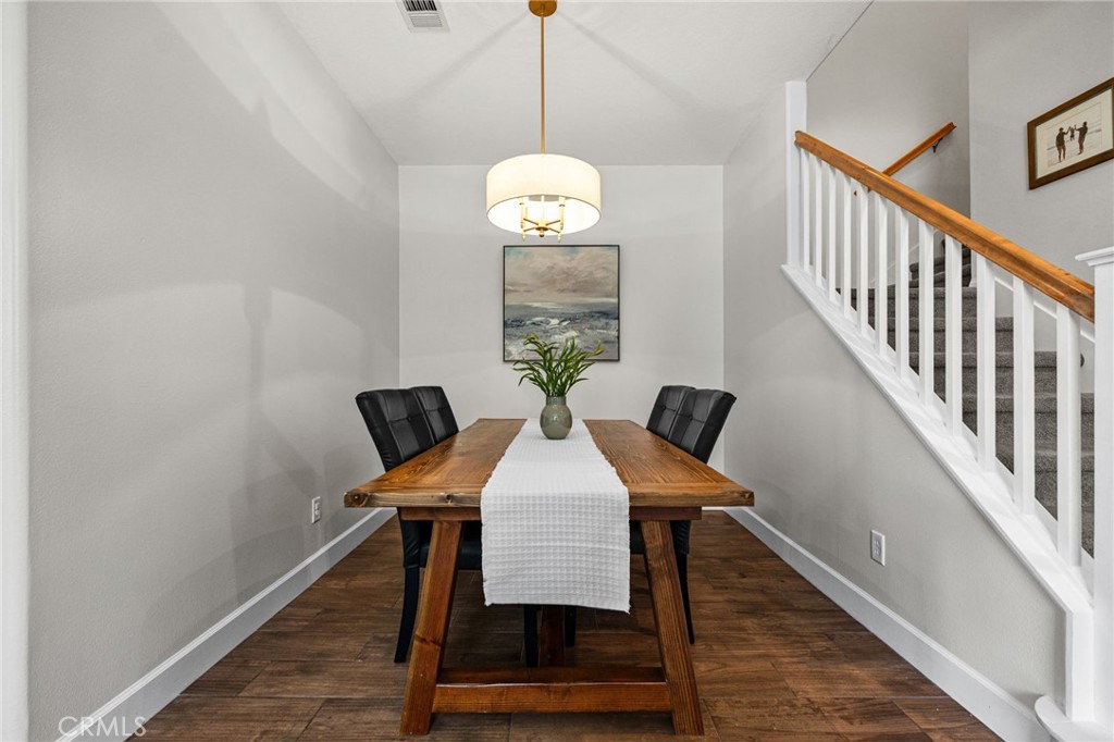 28356 Santa Rosa Lane Saugus, CA 91350 - Photo 27 of 50 a dining room with furniture and wooden floor