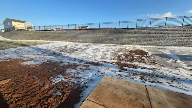 a kitchen with a refrigerator a microwave a stove and cabinets