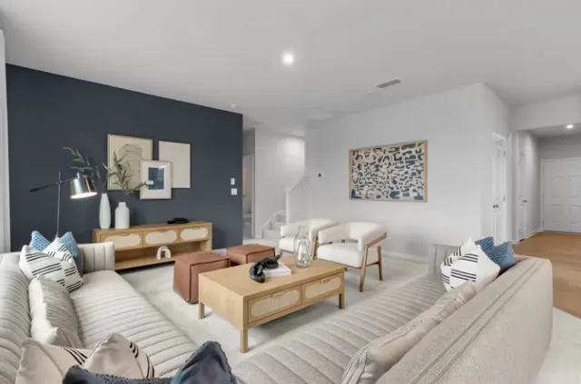 a bedroom with a bed table and chair