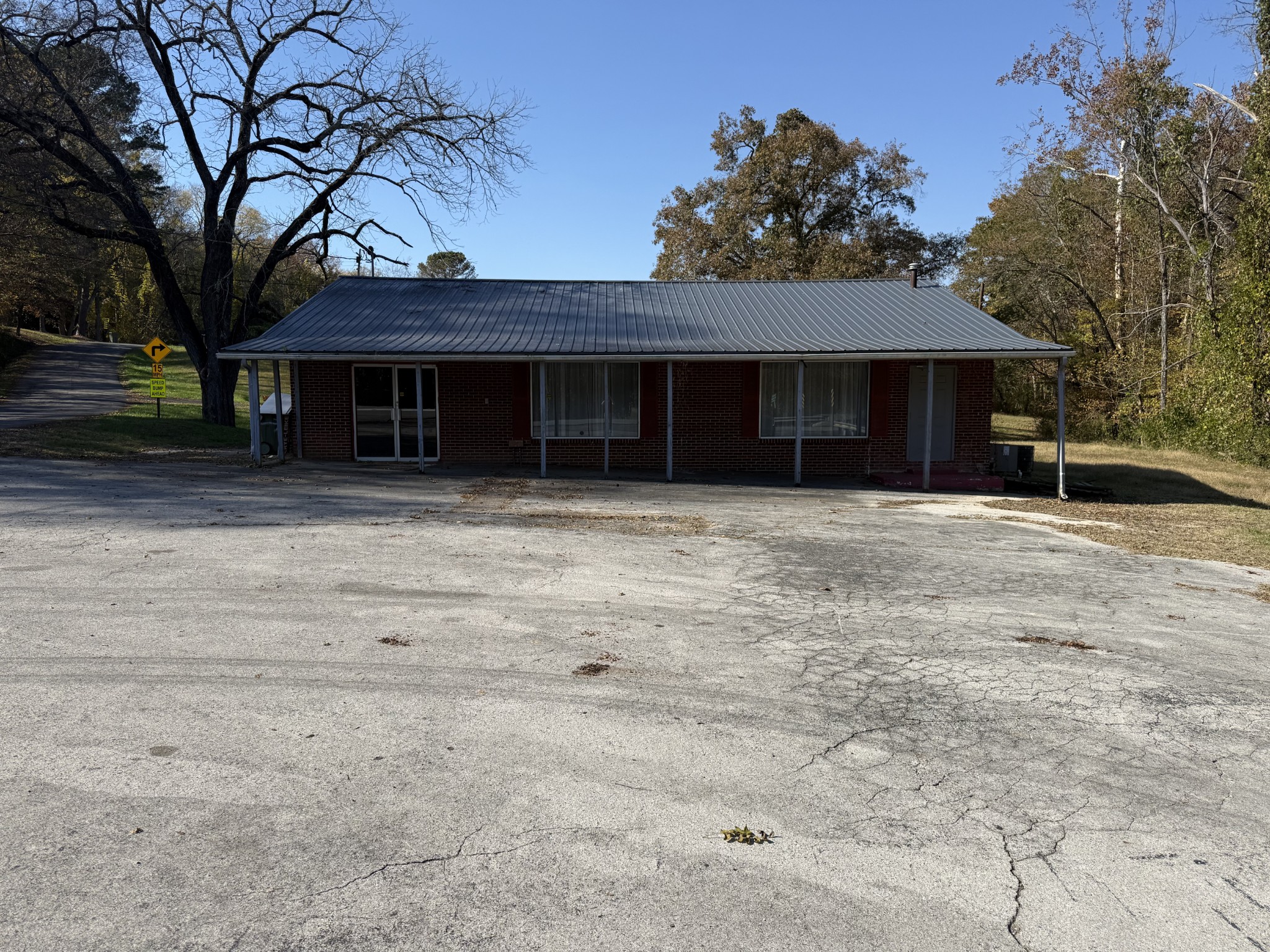 602 Old Florence Road Lawrenceburg, TN 38464 - Photo 2 of 7 front view of a house with a covered with trees