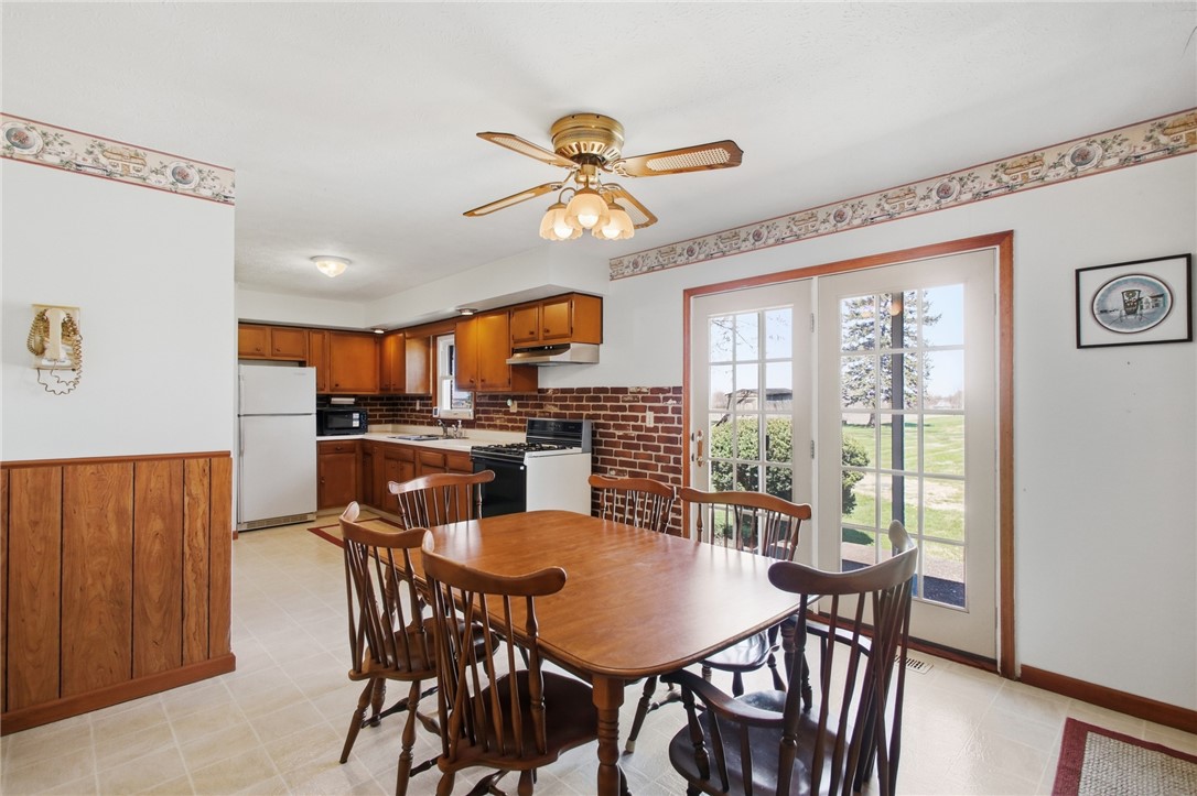 6718 Old Columbus Road South Vienna, OH 45369 - Photo 14 of 33 This cozy kitchen and dining area offers ample space for casual meals and entertaining.