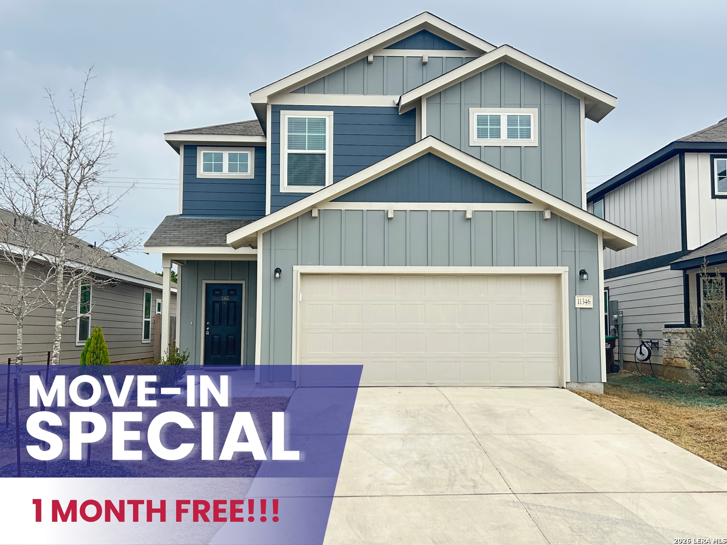 a view of a house with a garage and window