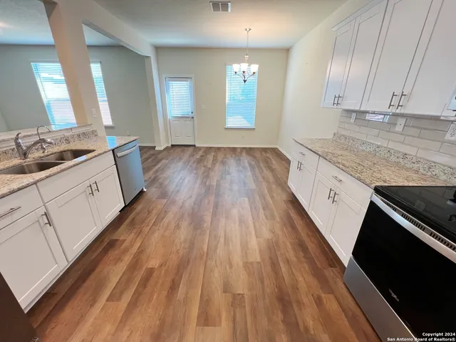 a bathroom with a sink and mirror