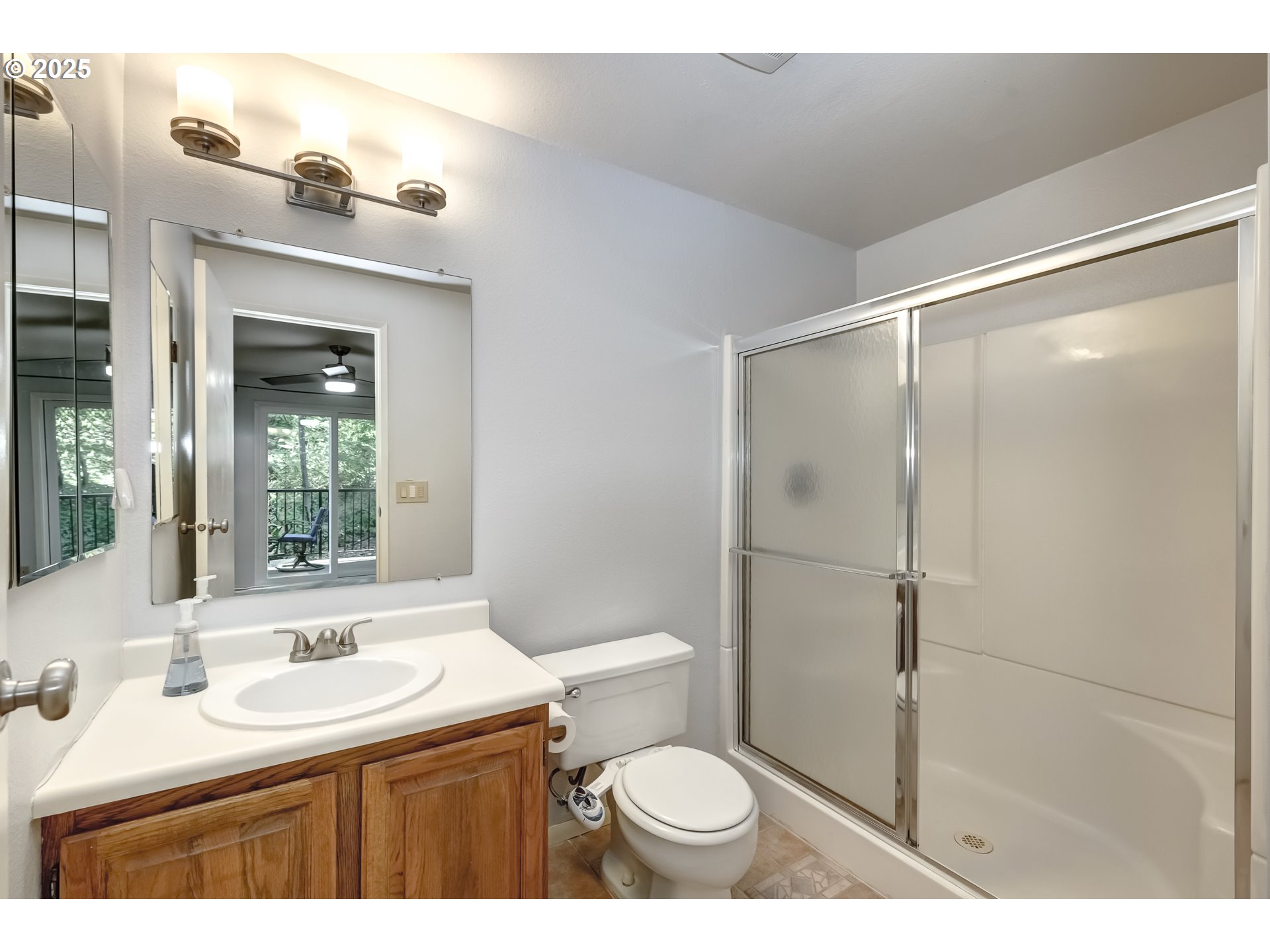 5557 Southwest Multnomah Boulevard Portland, OR 97219 - Photo 18 of 29 a bathroom with a sink toilet and shower