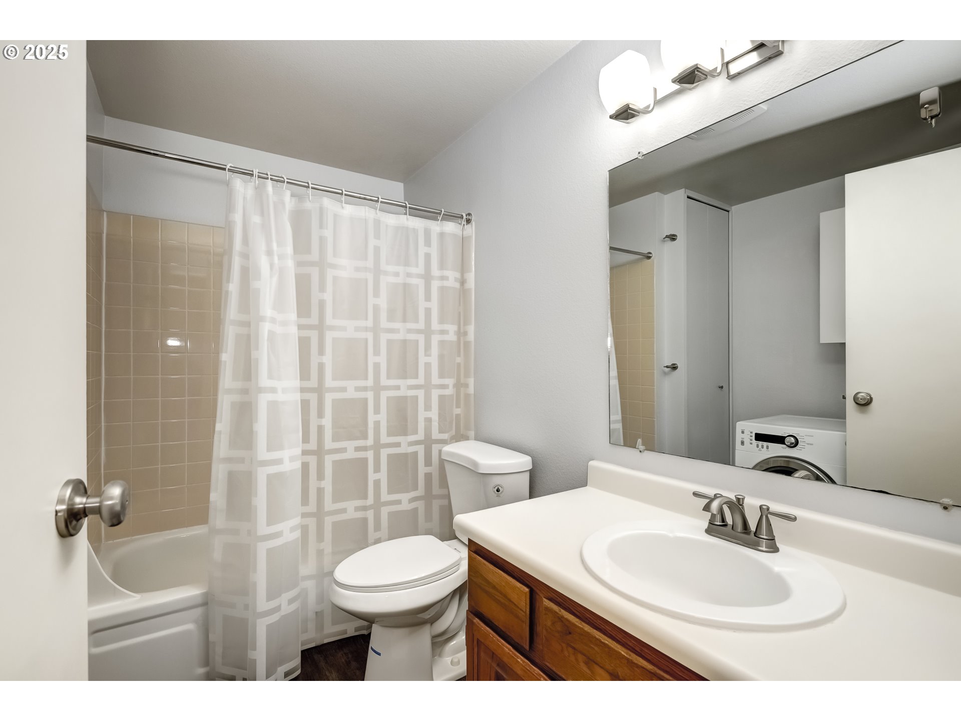 5557 Southwest Multnomah Boulevard Portland, OR 97219 - Photo 23 of 29 a bathroom with a sink a toilet and shower