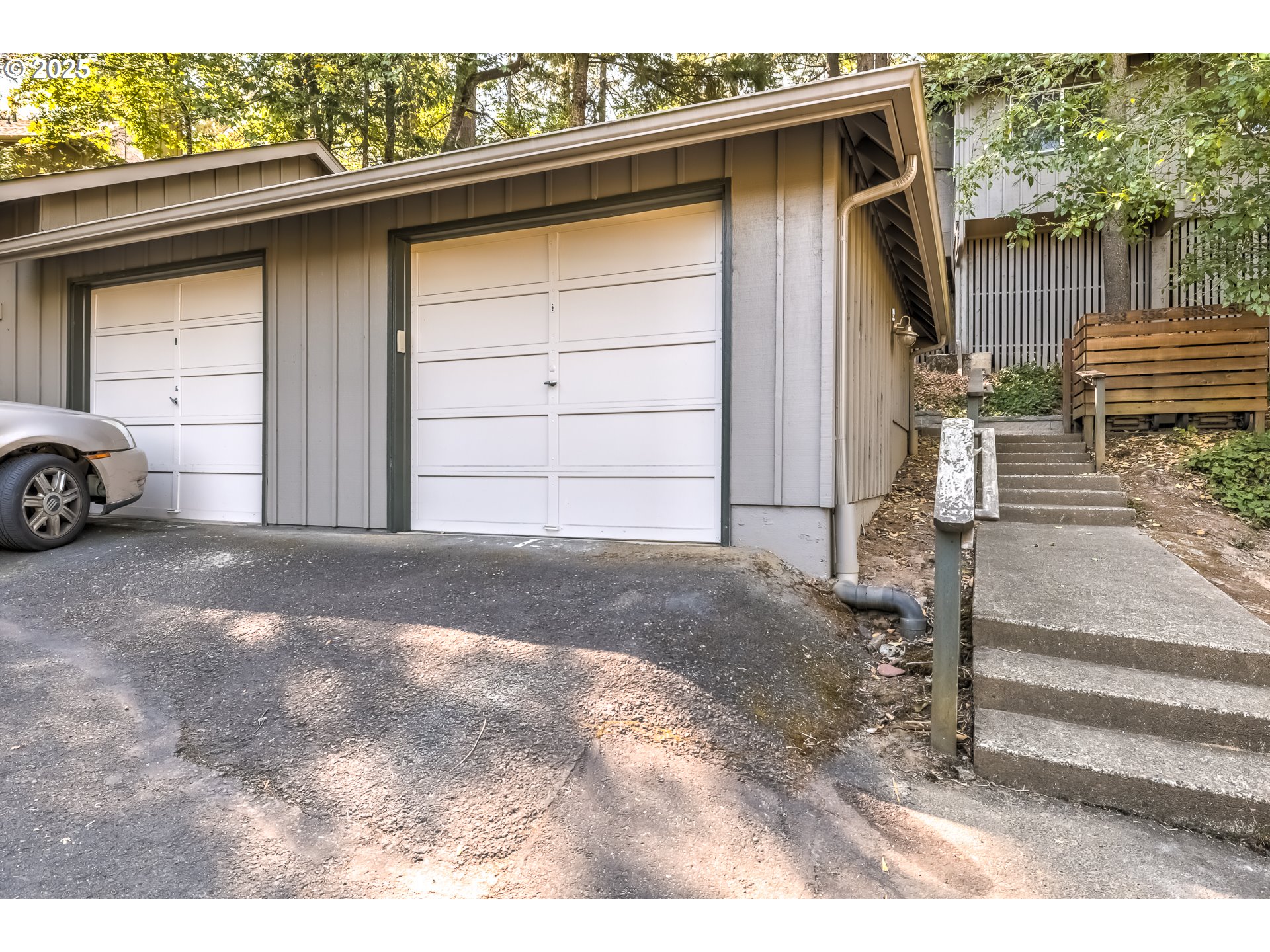 5557 Southwest Multnomah Boulevard Portland, OR 97219 - Photo 28 of 29 a view of a house with a wooden fence