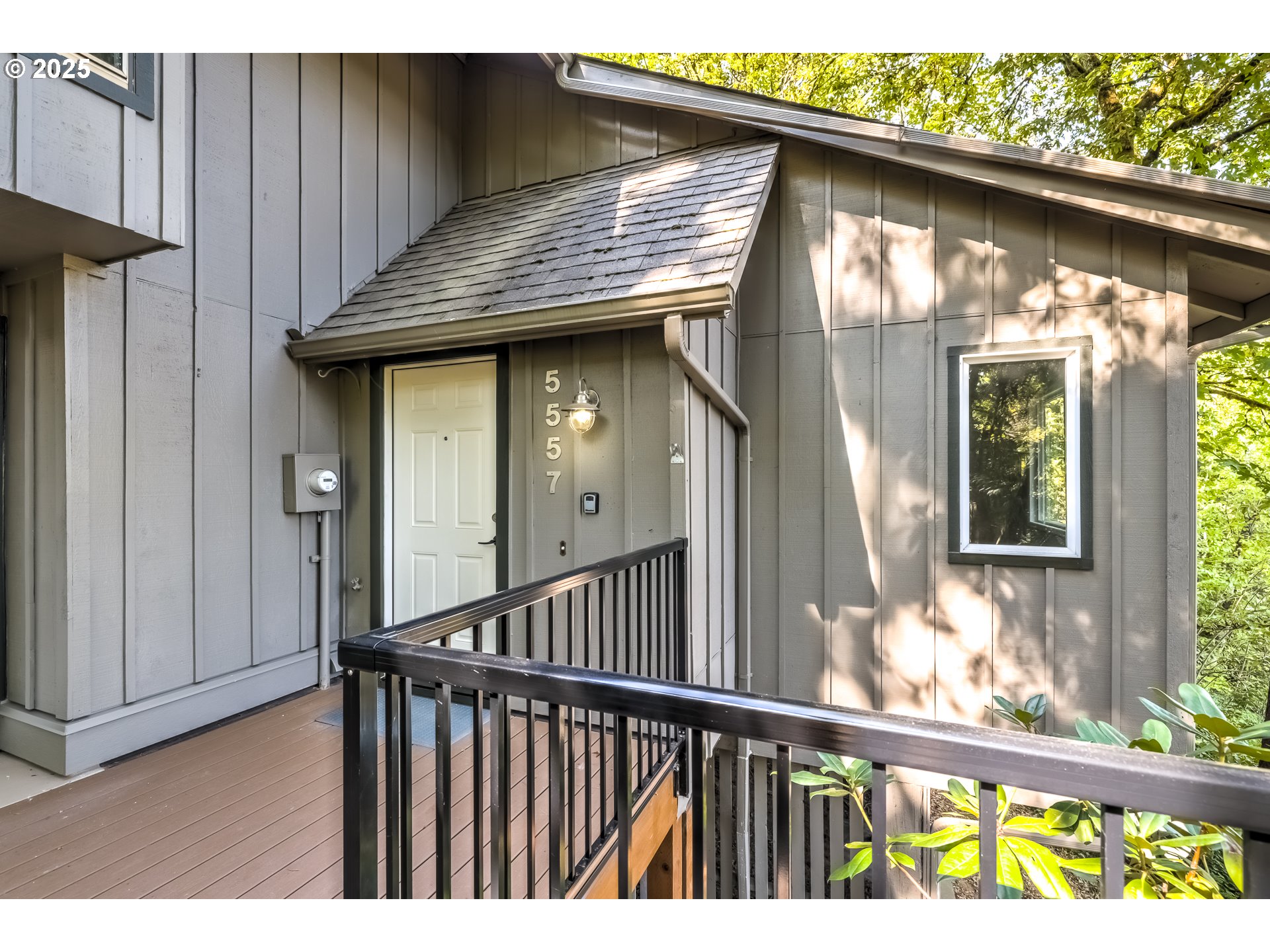 5557 Southwest Multnomah Boulevard Portland, OR 97219 - Photo 3 of 29 a view of a wooden door with a yard