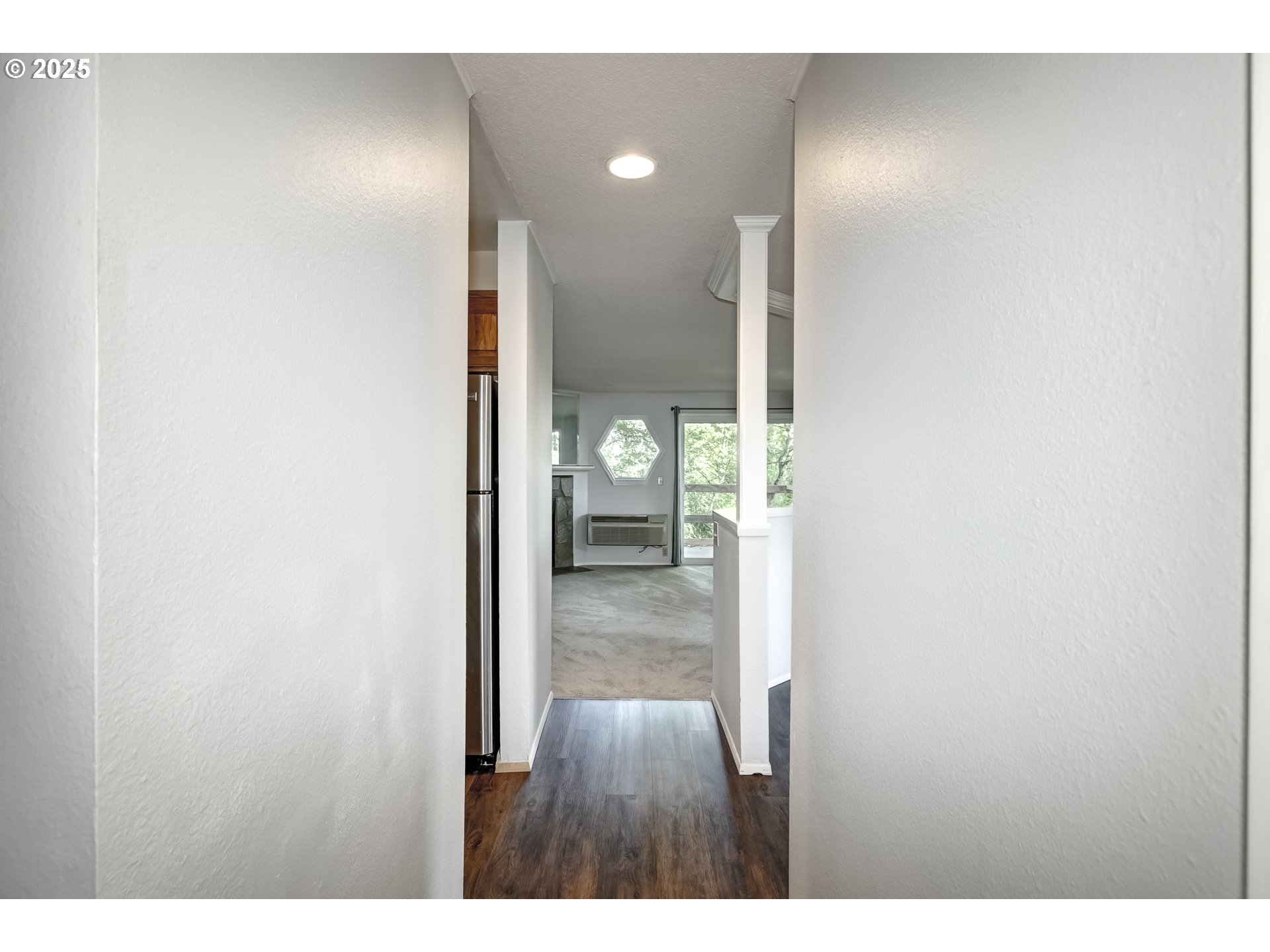 5557 Southwest Multnomah Boulevard Portland, OR 97219 - Photo 4 of 29 a view of hallway with wooden floor