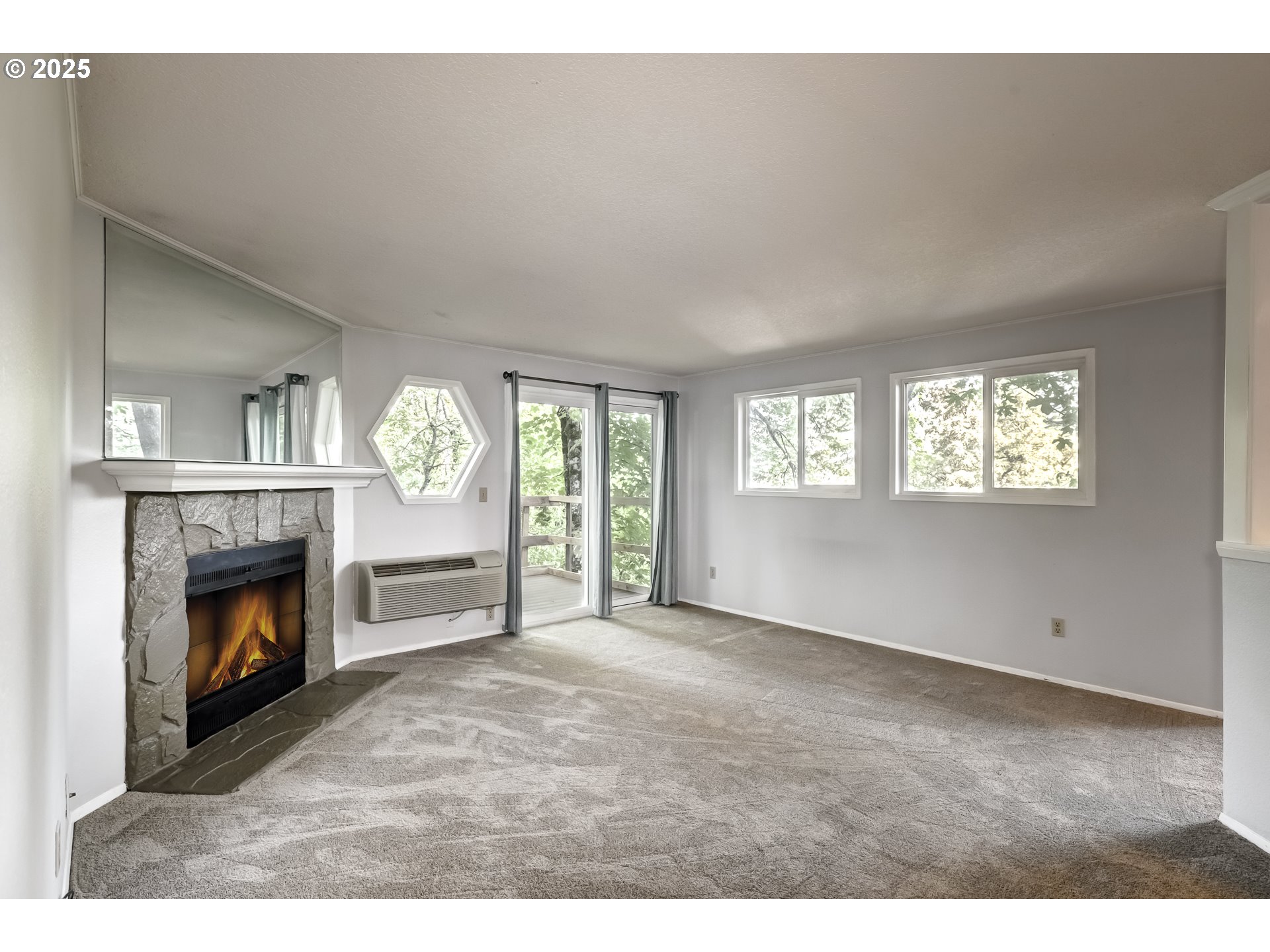 5557 Southwest Multnomah Boulevard Portland, OR 97219 - Photo 6 of 29 a view of empty room with window and fireplace