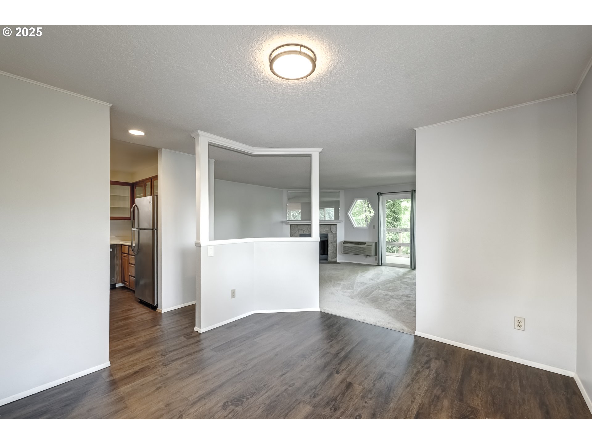 5557 Southwest Multnomah Boulevard Portland, OR 97219 - Photo 10 of 29 a view of empty room with wooden floor