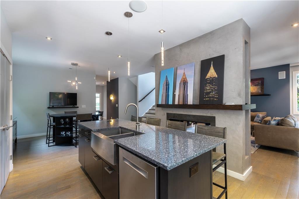 892 Durant Place Northeast Atlanta, GA 30309 - Photo 11 of 51 a kitchen with stainless steel appliances granite countertop a sink a stove and a refrigerator