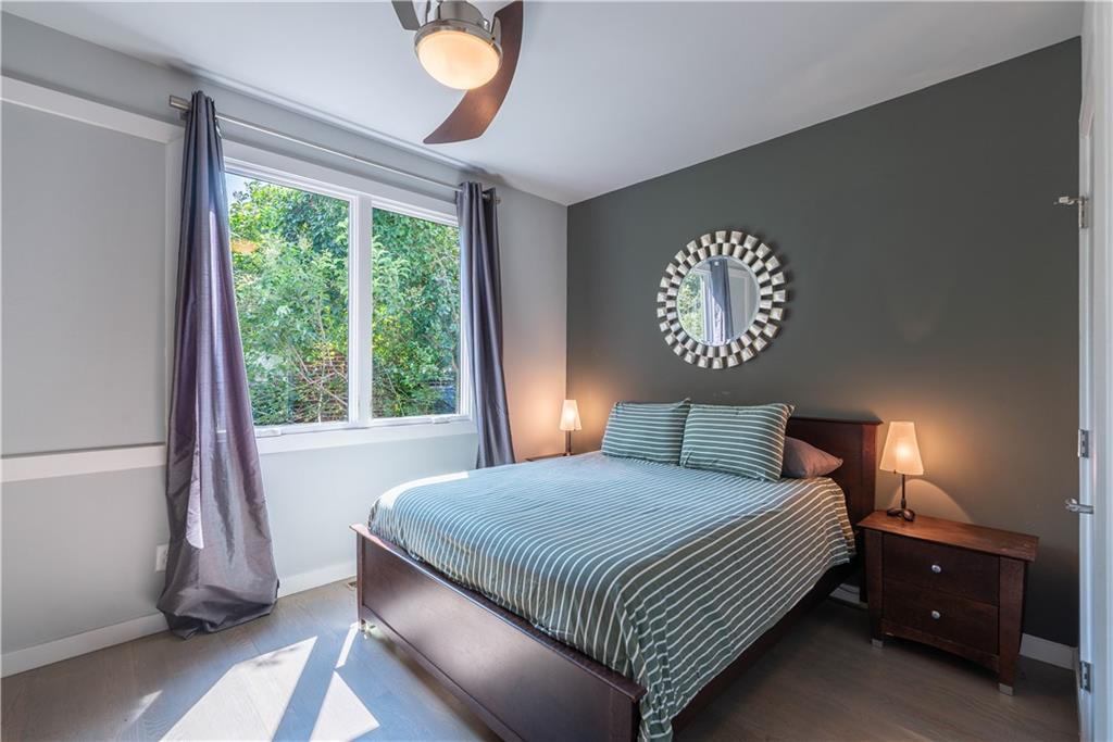 892 Durant Place Northeast Atlanta, GA 30309 - Photo 17 of 51 a bedroom with a bed and a window