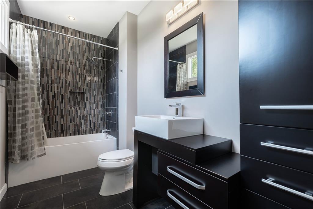 892 Durant Place Northeast Atlanta, GA 30309 - Photo 24 of 51 a bathroom with a sink toilet and shower