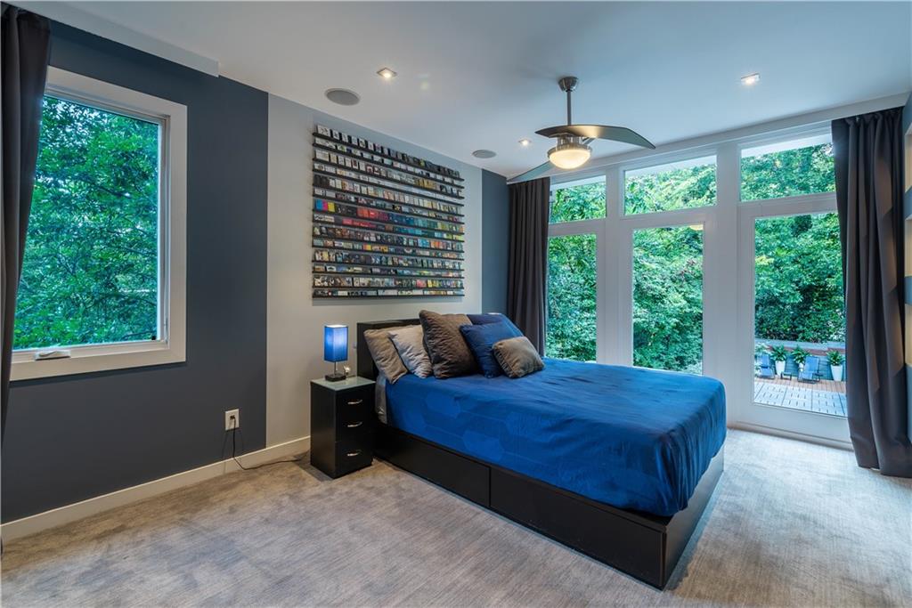 892 Durant Place Northeast Atlanta, GA 30309 - Photo 25 of 51 a bedroom with a bed and a large window
