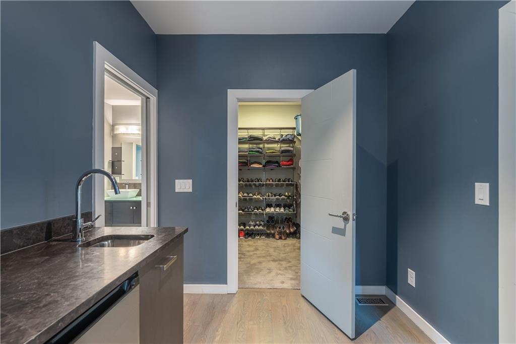 892 Durant Place Northeast Atlanta, GA 30309 - Photo 27 of 51 a kitchen with kitchen island a counter top space a sink and appliances