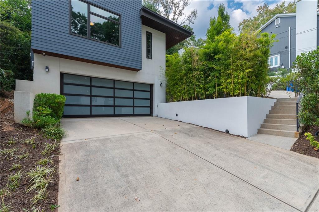 892 Durant Place Northeast Atlanta, GA 30309 - Photo 3 of 51 front view of a house with a yard