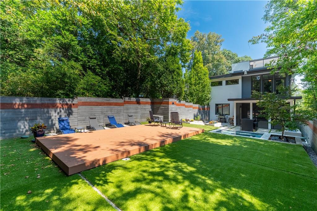 892 Durant Place Northeast Atlanta, GA 30309 - Photo 33 of 51 a view of a backyard with a sitting area and slide