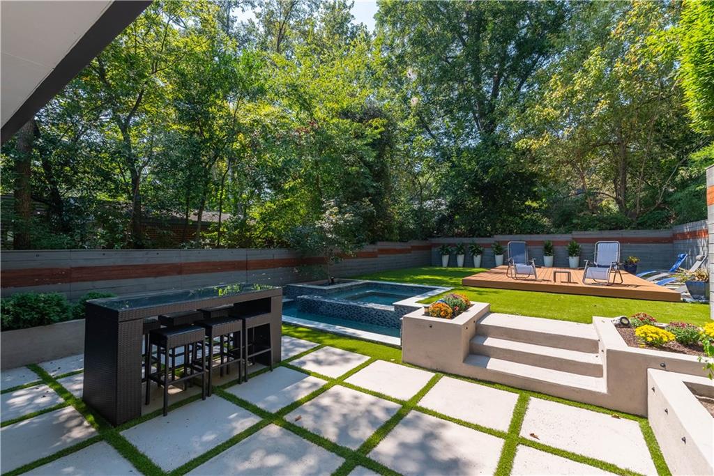 892 Durant Place Northeast Atlanta, GA 30309 - Photo 36 of 51 a view of a swimming pool with a lounge chair