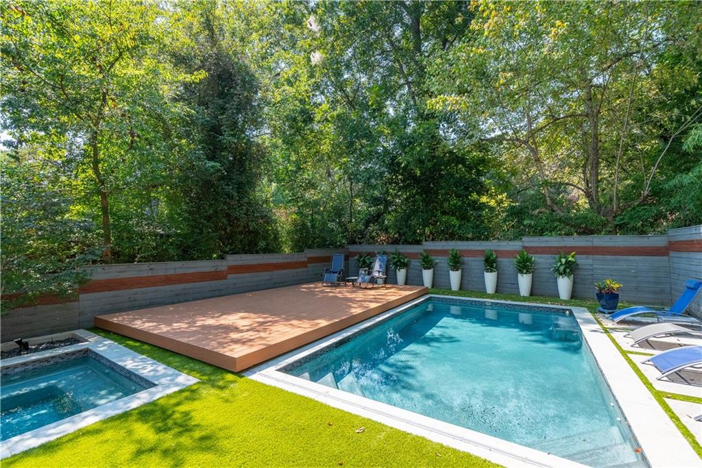 892 Durant Place Northeast Atlanta, GA 30309 - Photo 37 of 51 a view of a swimming pool with a lounge chair