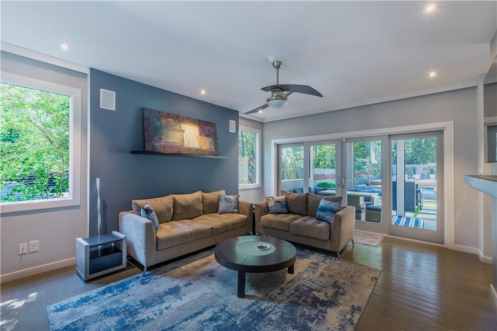 892 Durant Place Northeast Atlanta, GA 30309 - Photo 8 of 51 a living room with furniture and a flat screen tv