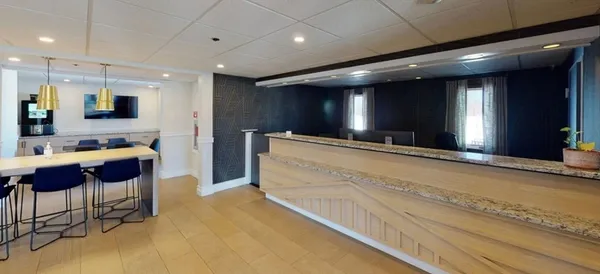 a bathroom with a sink and a large mirror