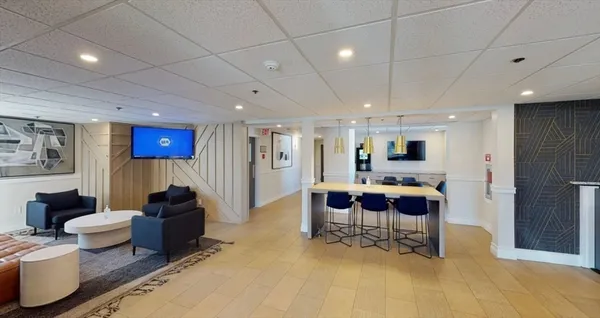 a living room with furniture and a table