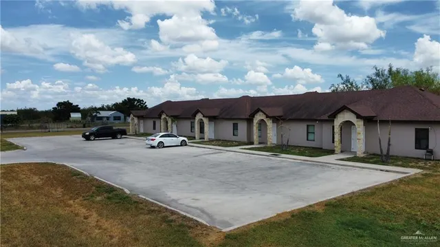 a view of a town with brick building and many windows