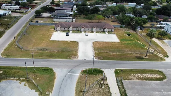 a view of a swimming pool with a yard