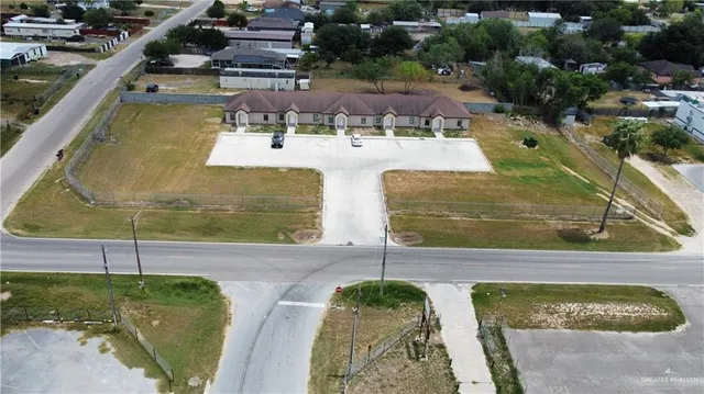 a view of a swimming pool with a yard