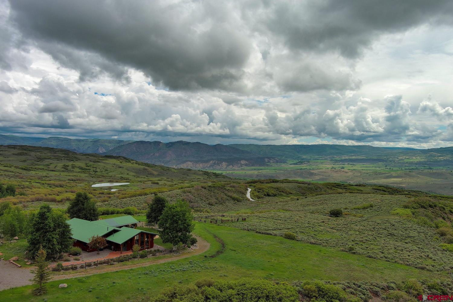 a view of a golf course with an ocean