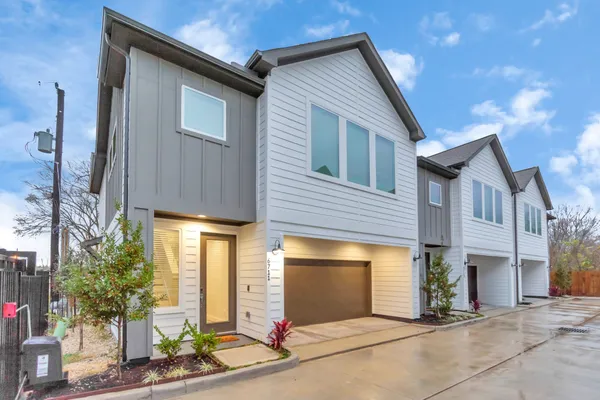 a front view of a house with yard
