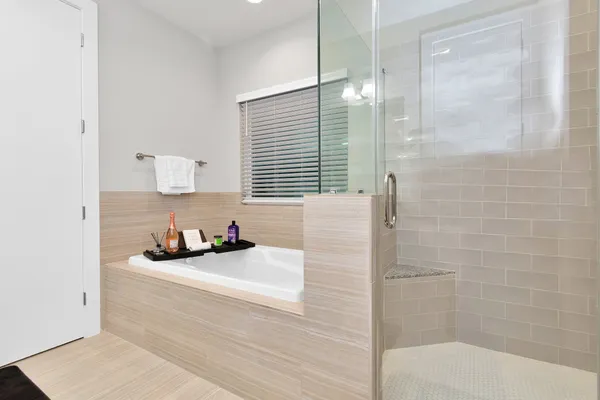 a bathroom with a sink a shower and a mirror