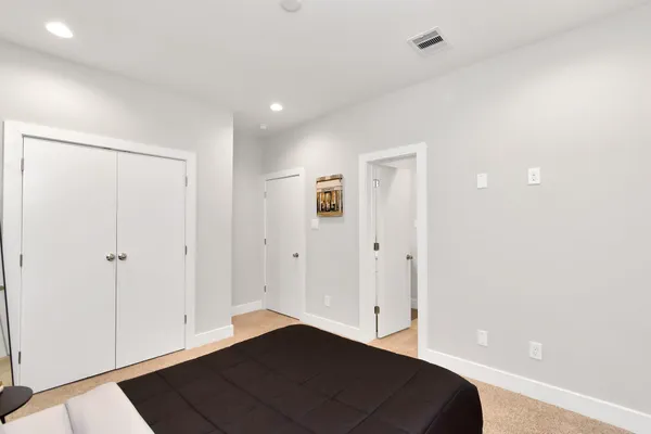 a white toilet sitting next to a bathroom sink