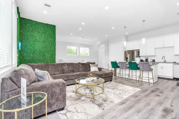 a living room with furniture and a large window