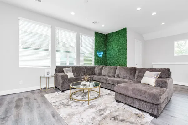 a living room with furniture and a large window