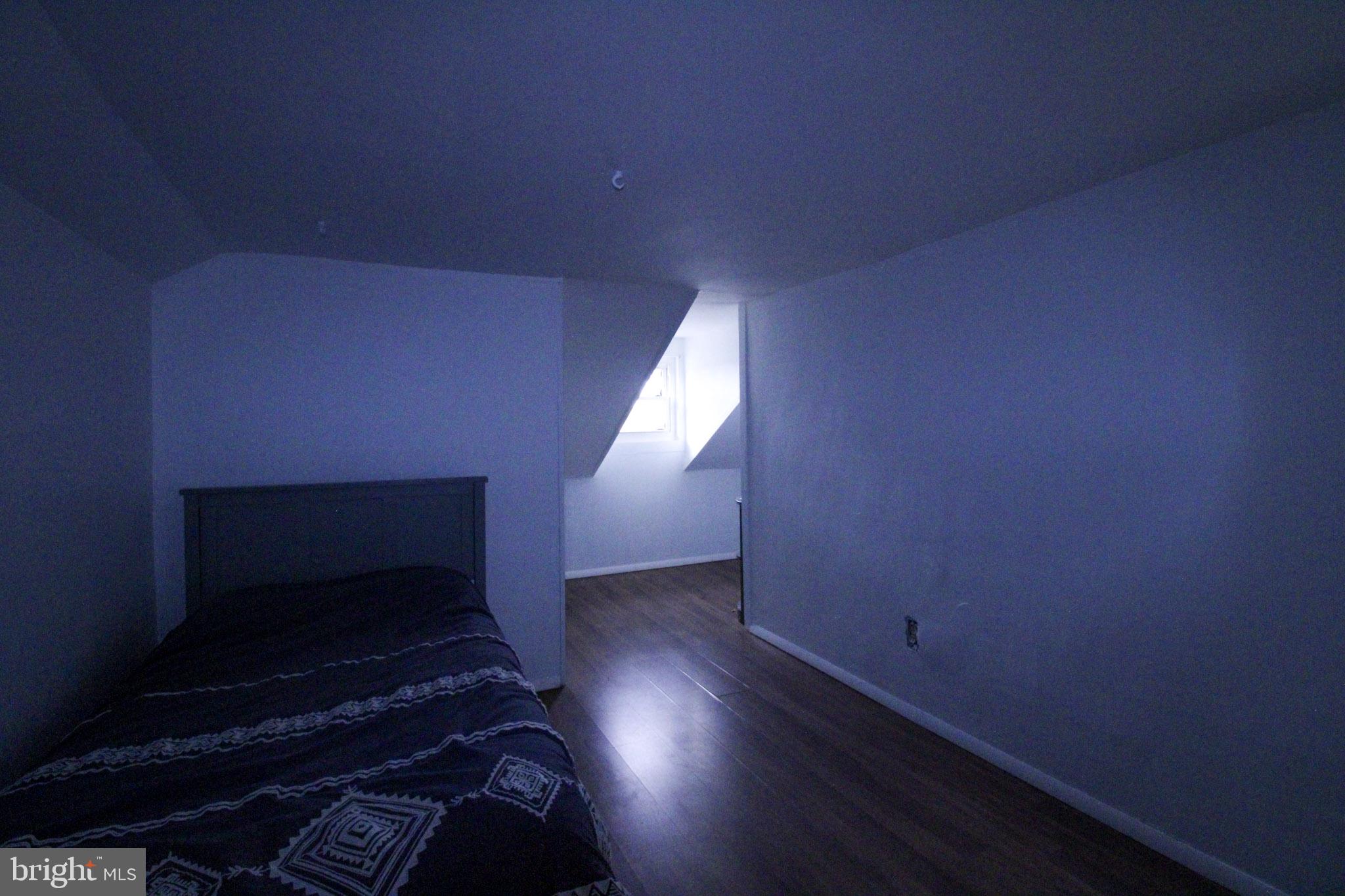 2486 Owl Town Road Callao, VA 22435 - Photo 14 of 14 a view of an empty room with wooden floor and a window