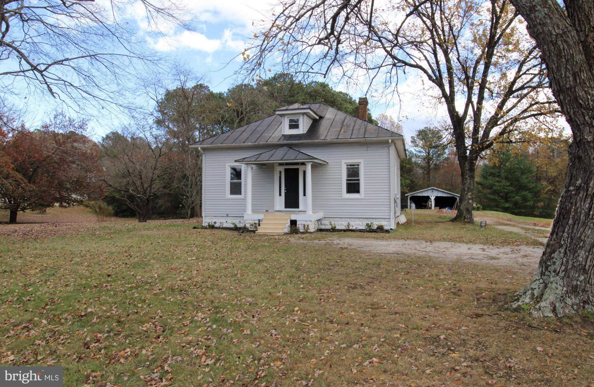 2486 Owl Town Road Callao, VA 22435 - Photo 4 of 14 a front view of a house with a yard