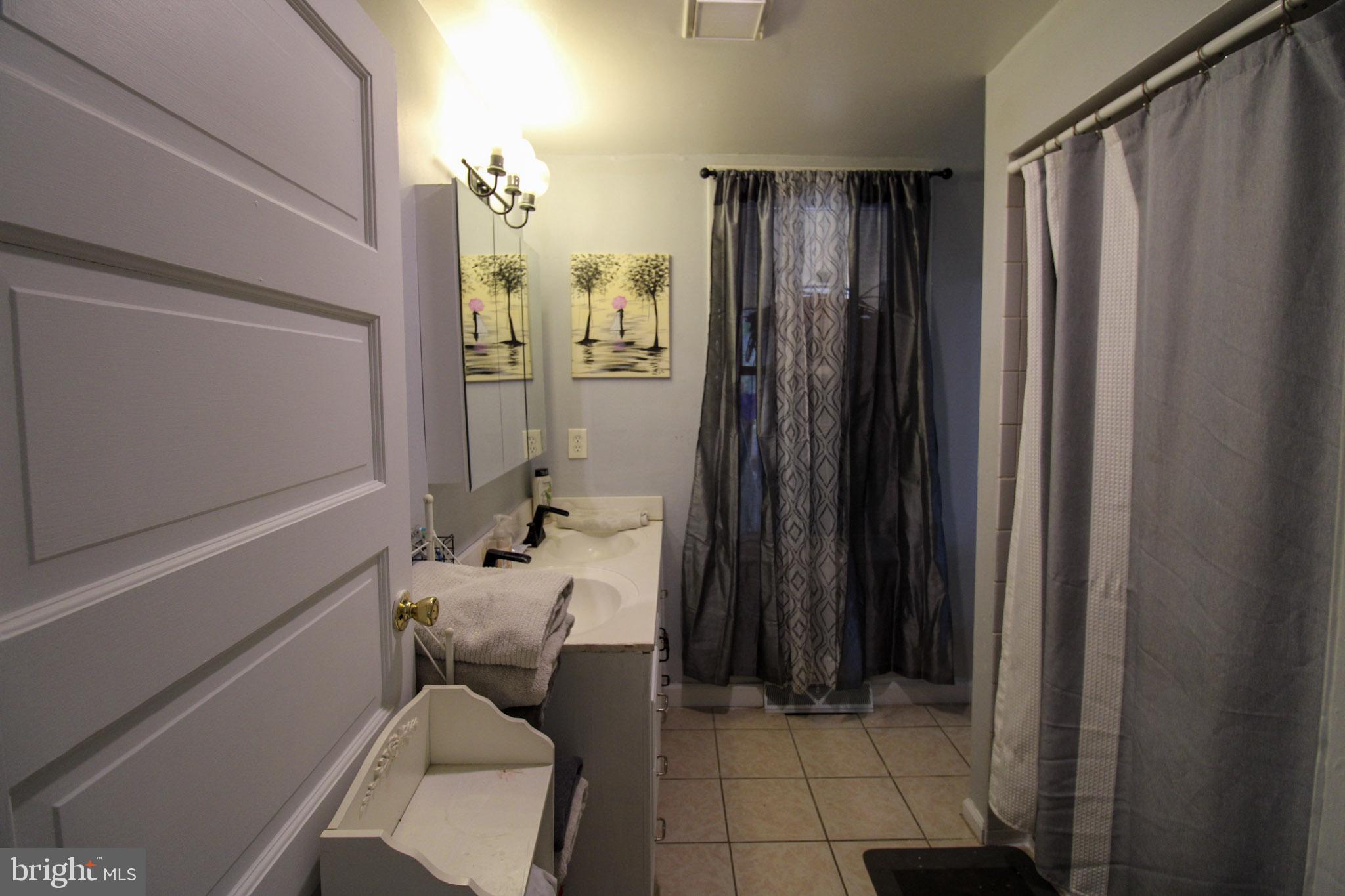 2486 Owl Town Road Callao, VA 22435 - Photo 7 of 14 a bathroom with shower curtain