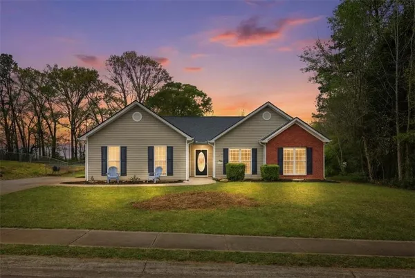 a front view of a house with a yard