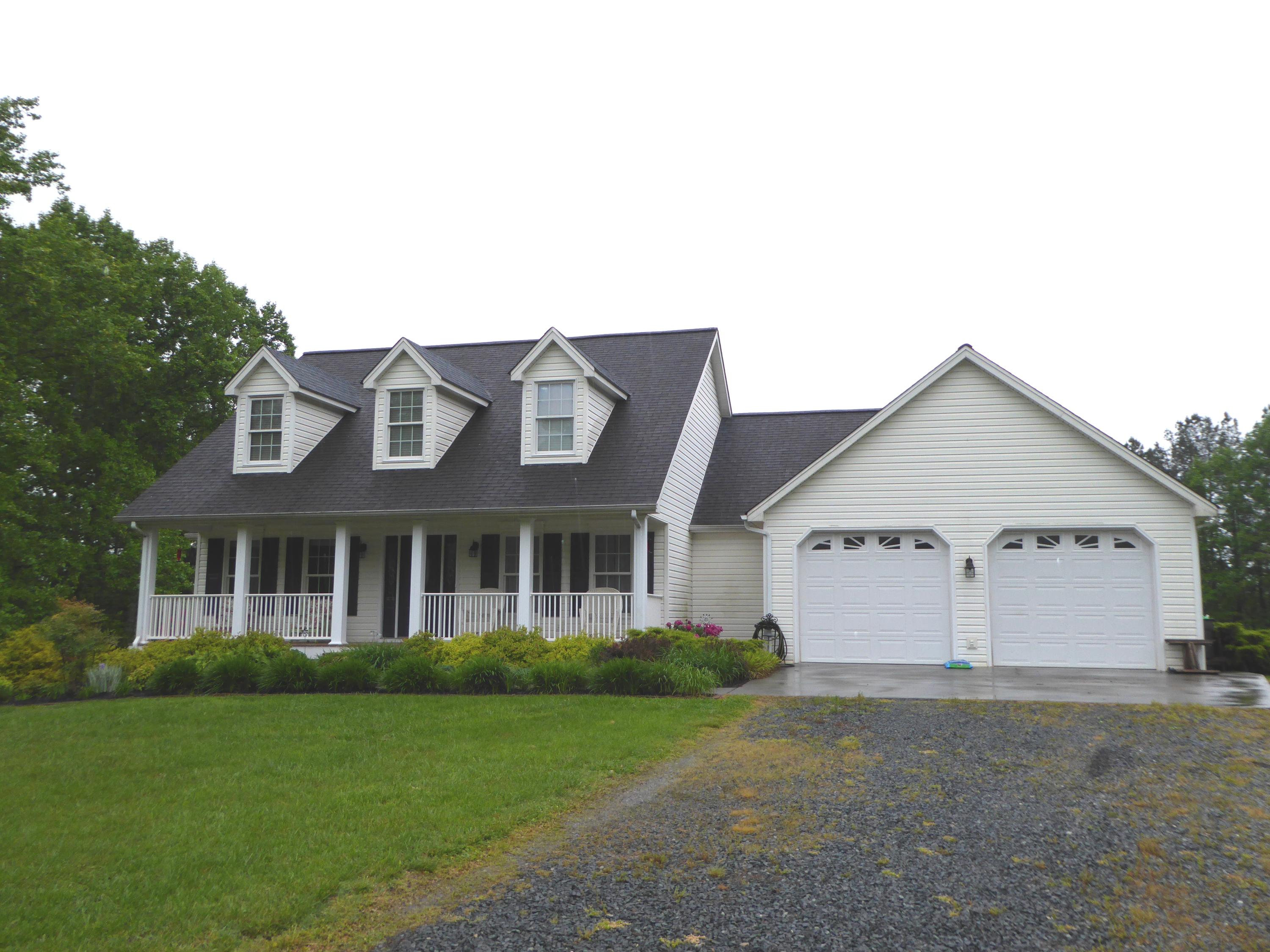 7740 Edwardsville Road Hardy, VA 24101 - Photo 1 of 92 a view of a white house next to a yard with large trees